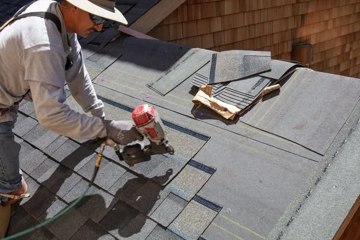 Roofing contractor performing hurricane storm damage assessment on a home in Orlando Florida